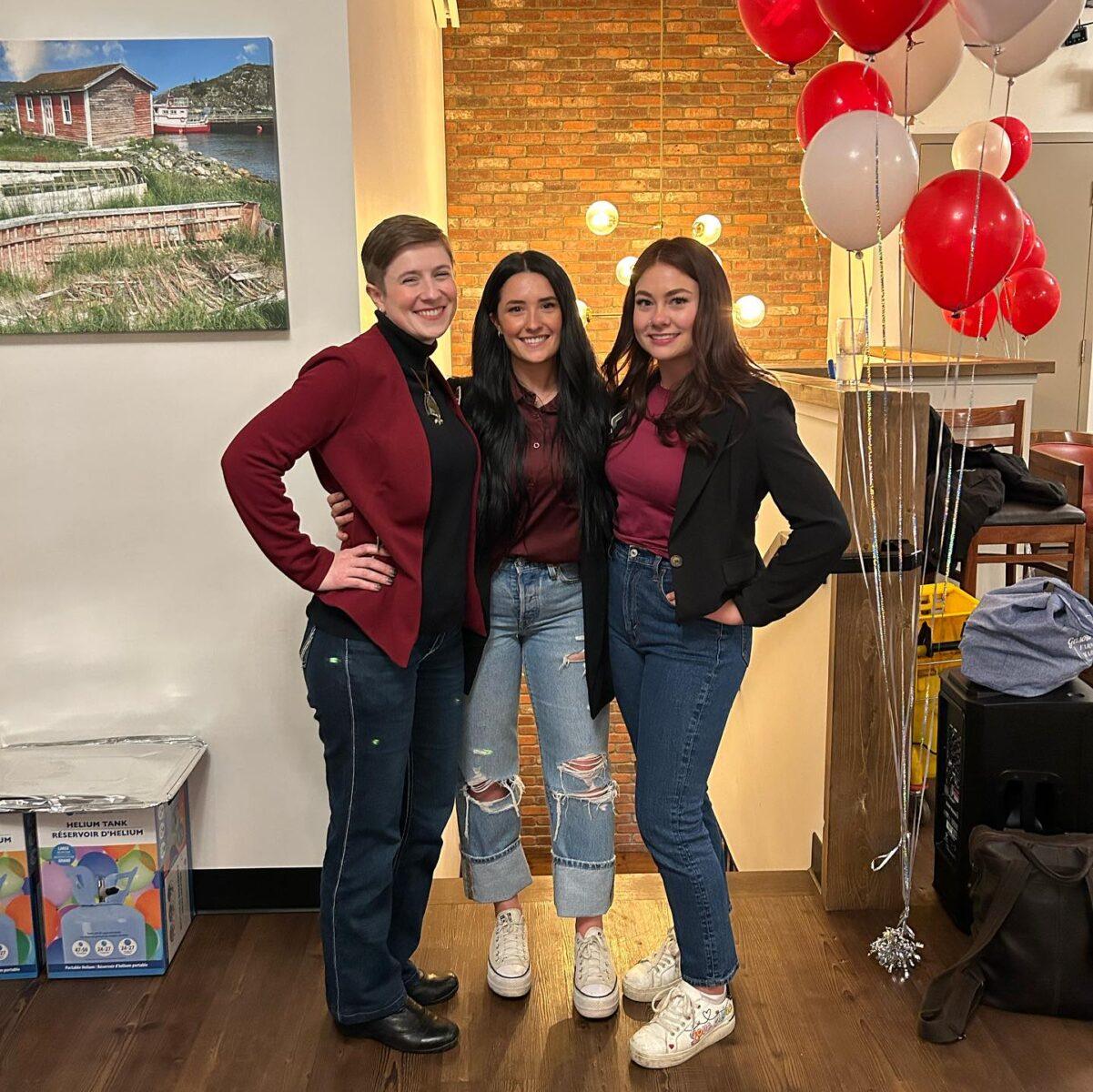 Marketing and Admin Team smiling towards the camera.